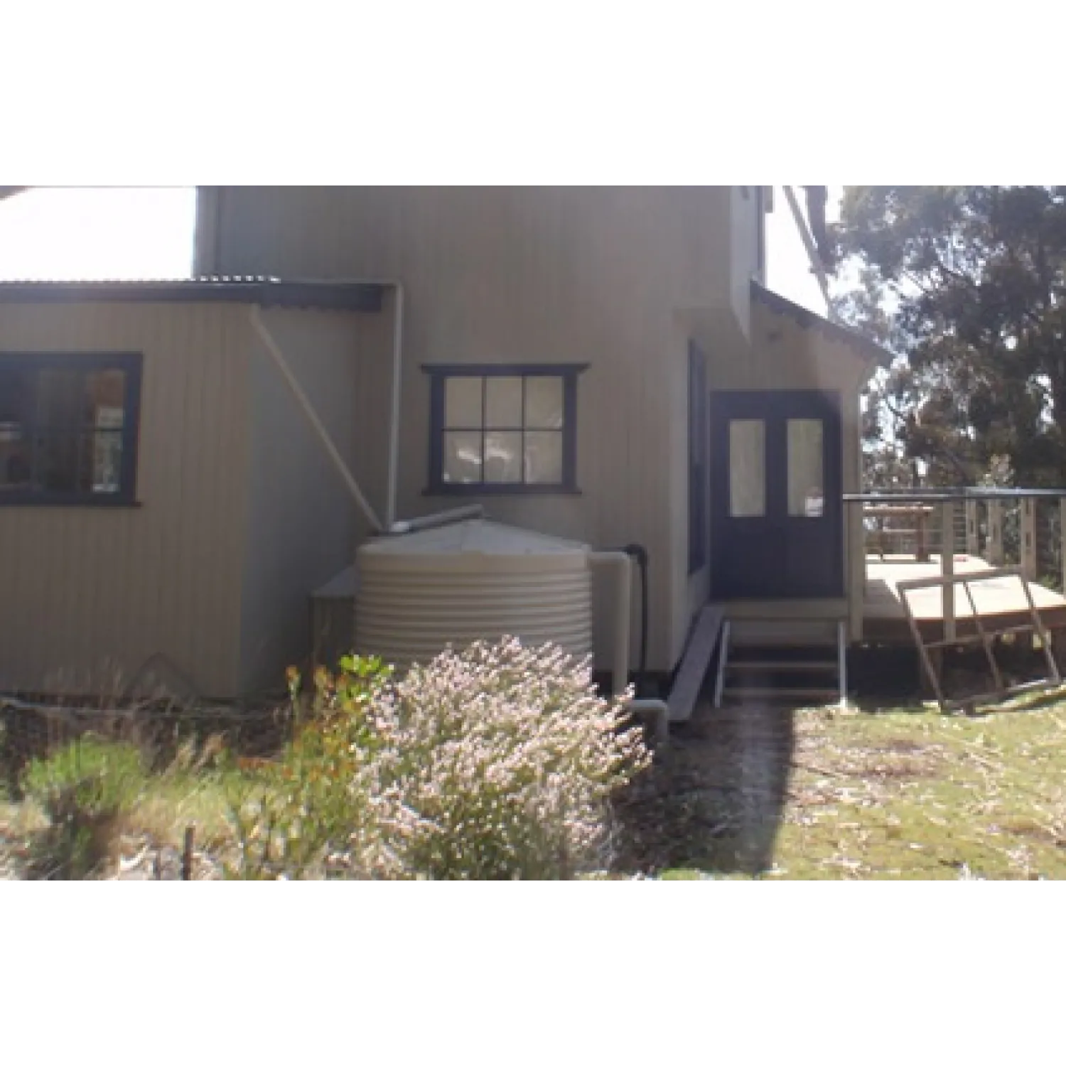 2100 Ltr Corrugated Rainwater Tank fitting in with home colours