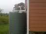 2400 Ltr Corrugated Rainwater Tank complementing timber panels