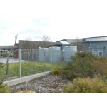 Three Orion Australia 4600 Ltr Corrugated Rainwater Tanks in a school