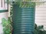 950 Ltr Corrugated Rainwater Tank on bricks with ferns by Orion Australia