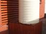 950 Ltr Corrugated Rainwater Tank on stained timber box