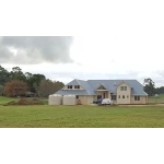22000 Ltr Panelled Wall Rainwater Tank on a Colorbond® home with bricks and render