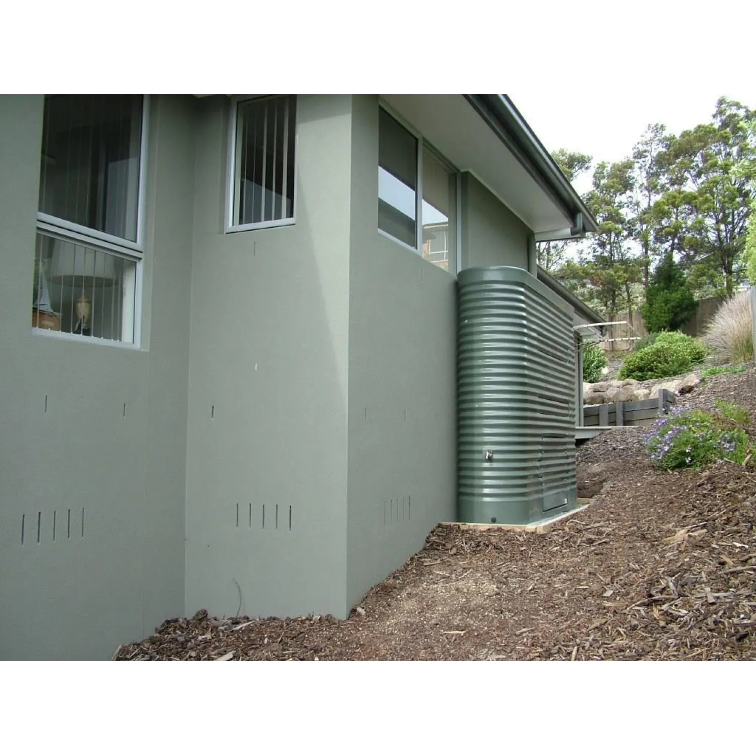 A durable 2000 litre Poly Slimline Tank in Woodland Grey