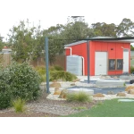 1000 Ltr Corrugated Slimline Tank on school shed next to play area